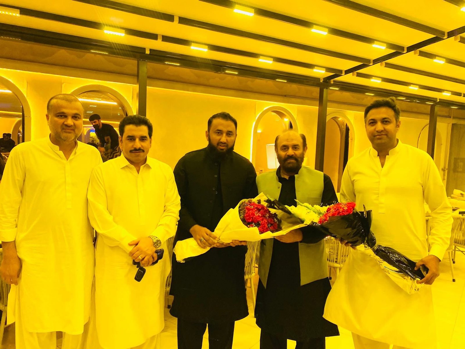 Ibraheem Awan with a vehicle and travel partners